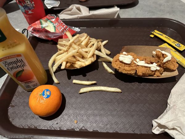 Kids chicken strips with juice and fruit I had for late dinner at Cosmic Ray's Starlight CafÃ© in Magic Kingdom