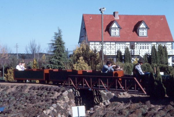 1986 - Mini train crossing the bridge at Cockington Green