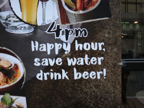 Happy hour, save water, drink beer!  Sign outside a pub on Wellington St