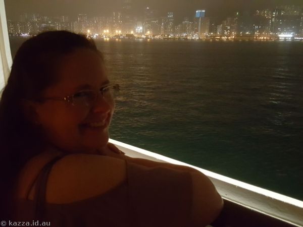 Me on our balcony with view of Hong Kong