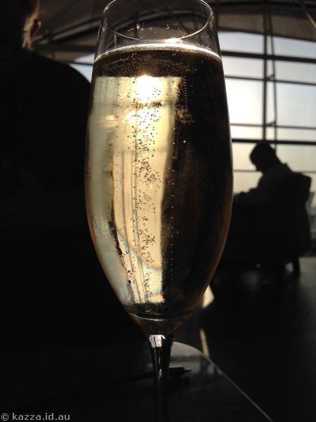 Champagne in the Qantas Club at sunset