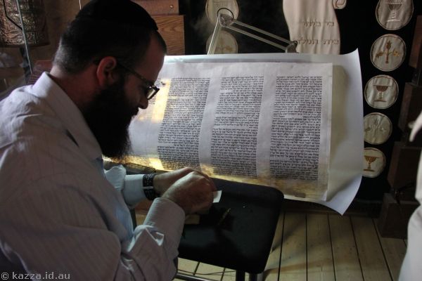 This man was writing out the Torah.  He wrote a blessing for Bruce