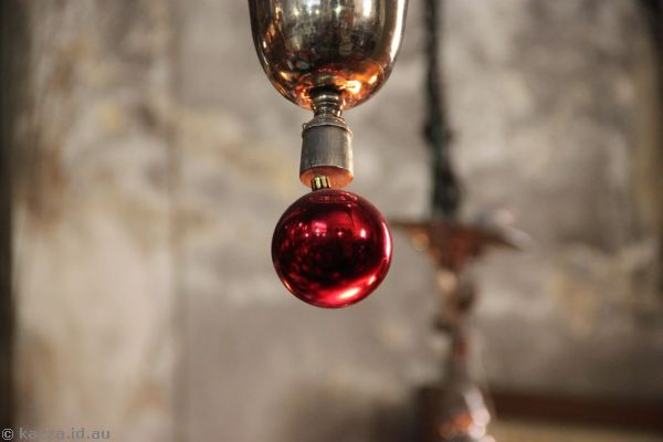 Gotta love the Christmas decorations hanging from the chandeliers