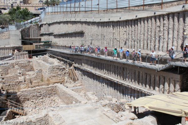 The group walking along the wall of the archaelogical site<br/>Photo by Dad