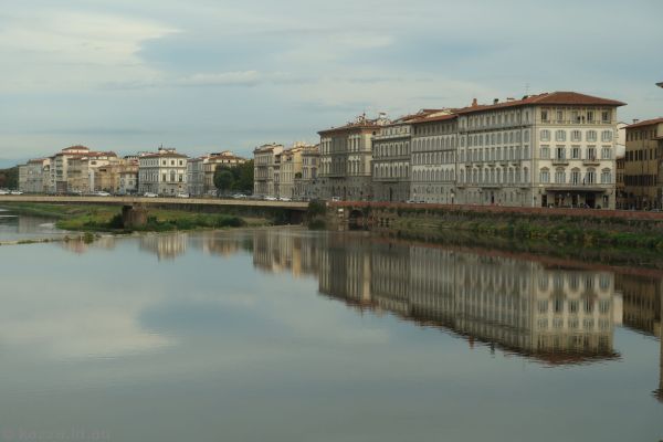 Buildings reflected in the Arno River