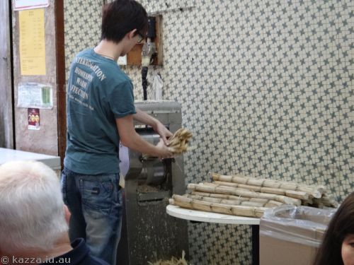 Sugar cane goes in ..
