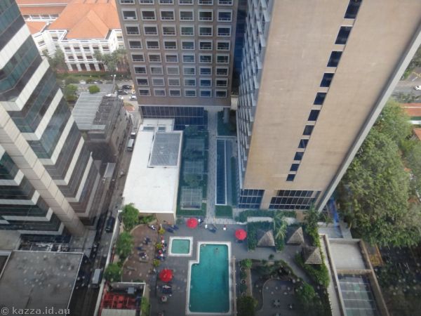 View of the pool from the lift lobby of our hotel