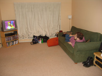 Stu relaxing for a moment in front of the Simpsons