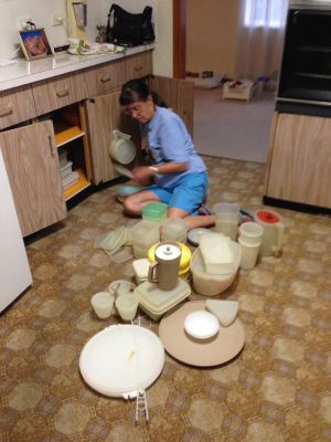 Mum sorts tupperware