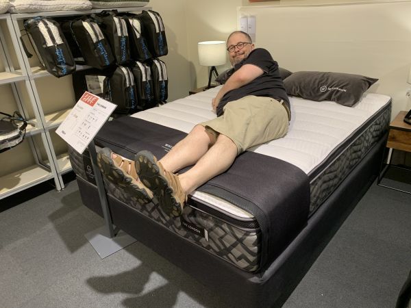 Stu testing a mattress