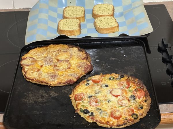 Pizzas and garlic bread