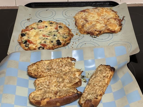 Pizzas and garlic bread