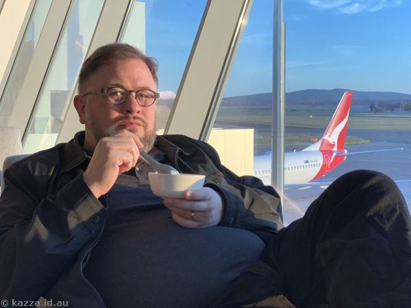 Stu eating breakfast at the Qantas Club in Canberra