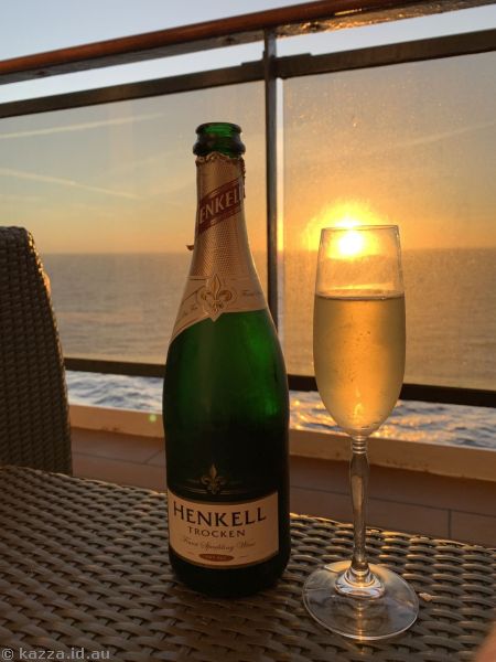 Drinking champagne at sunset on our balcony