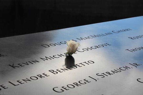 As a tribute, the 9/11 Memorial places roses upon victim's names on their birthdates
