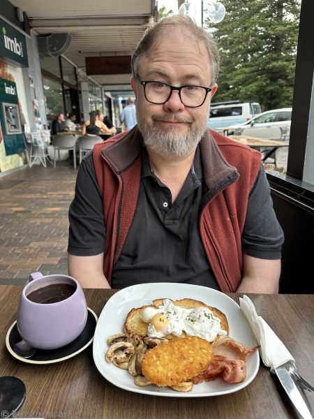 Stu with his breakfast (poached eggs, with extra bacon, mushrooms and hashbrowns) at Park Central Cafe in Kiama