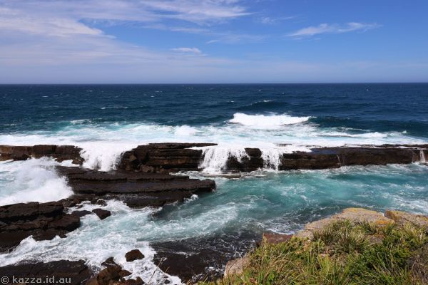 Waves crashing over rocks at Penguin Head Culburra