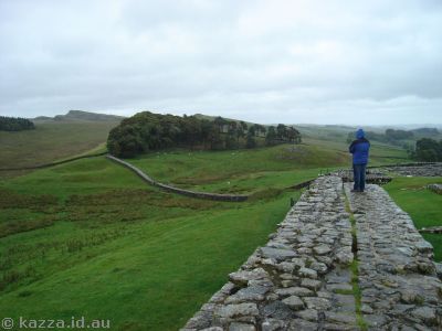 Stu on the fort wall looking out at Hadrian's Wall