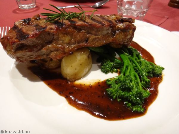Flame-grilled beef porterhouse steak served with confit chat potatoes, wilted greens and black pepper jus.  This was a bit over done on the edges but not too bad in the middle