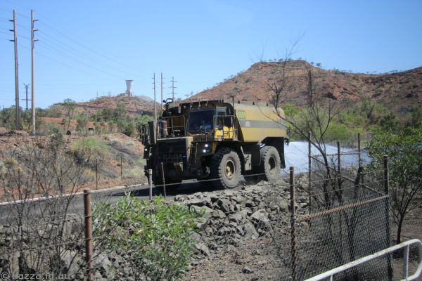 Truck wetting down the road at Mt Isa Mines