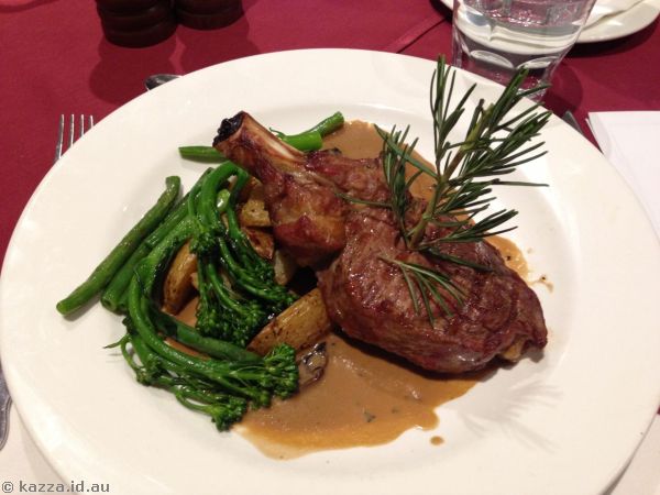 Chargrilled veal on the bone served with crispy potato wedges, wilted greens and mushroom sauce.  Beautiful and tender