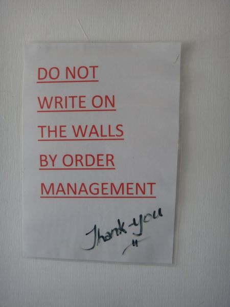 Do not write on the walls sign