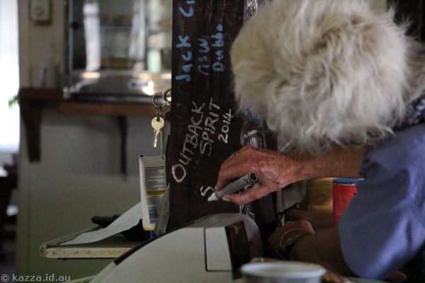 Penny graffitiing the walls of the Blue Heller Pub