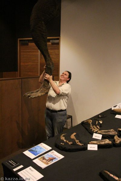 Kathrine showing the scale of a dinosaur leg