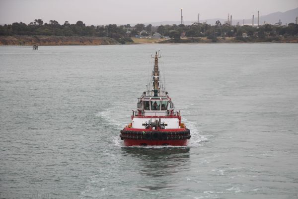 Tug boat following us to make sure we get out ok